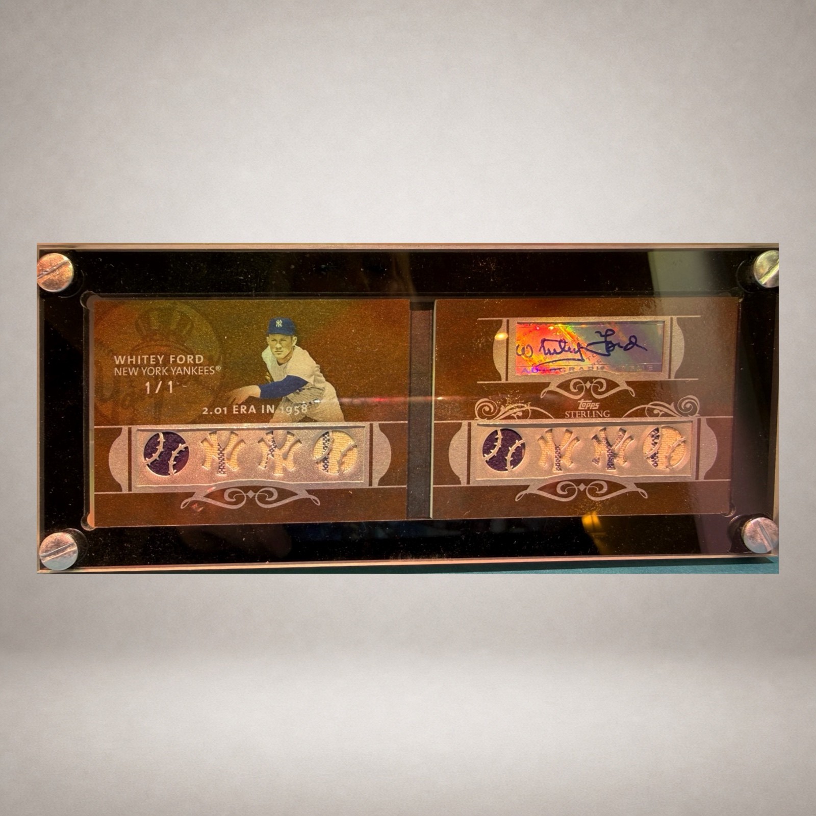Open Whitey Ford Topps Sterling autograph relic booklet marked one of one