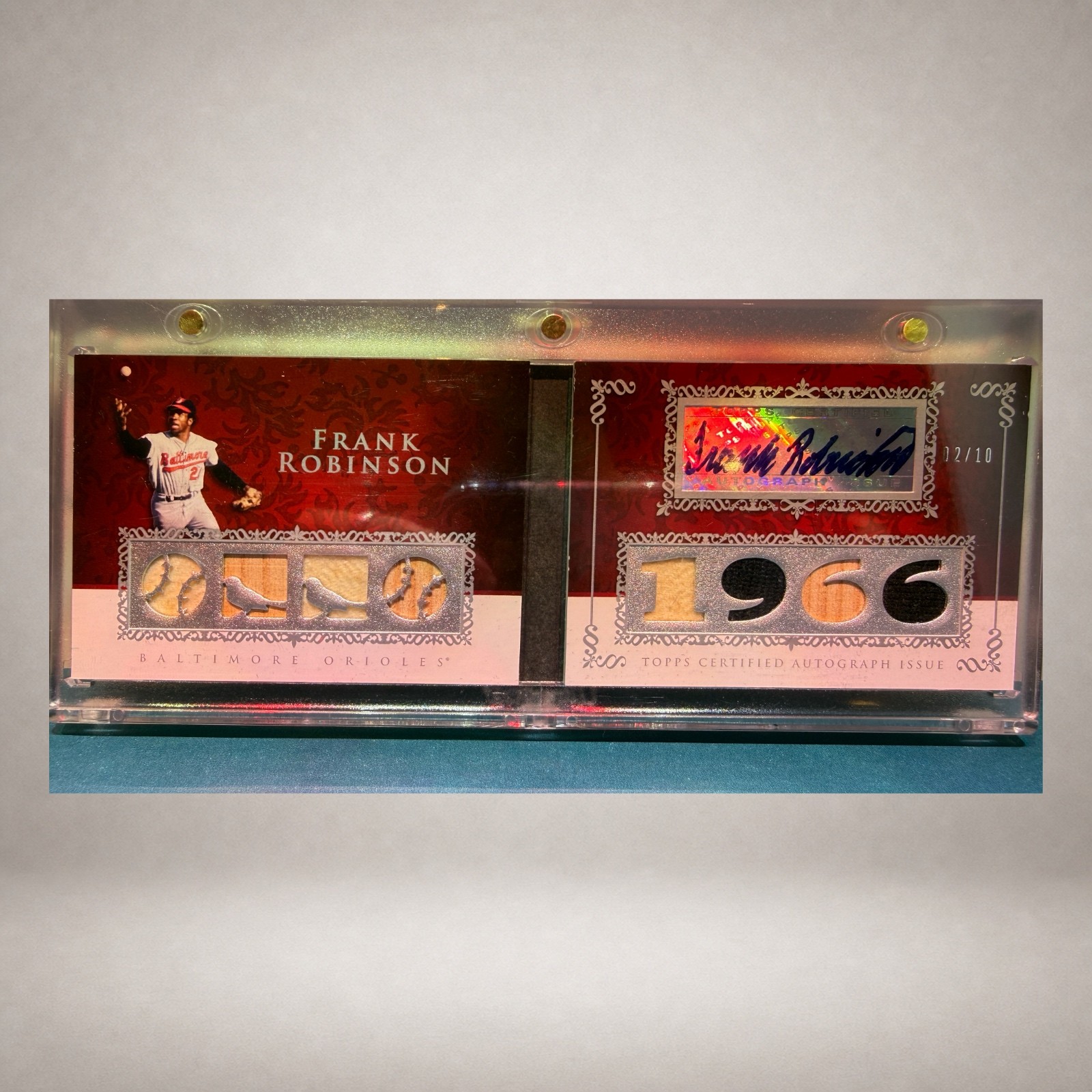 Open Frank Robinson Topps Sterling autograph relic booklet numbered 02 of 10