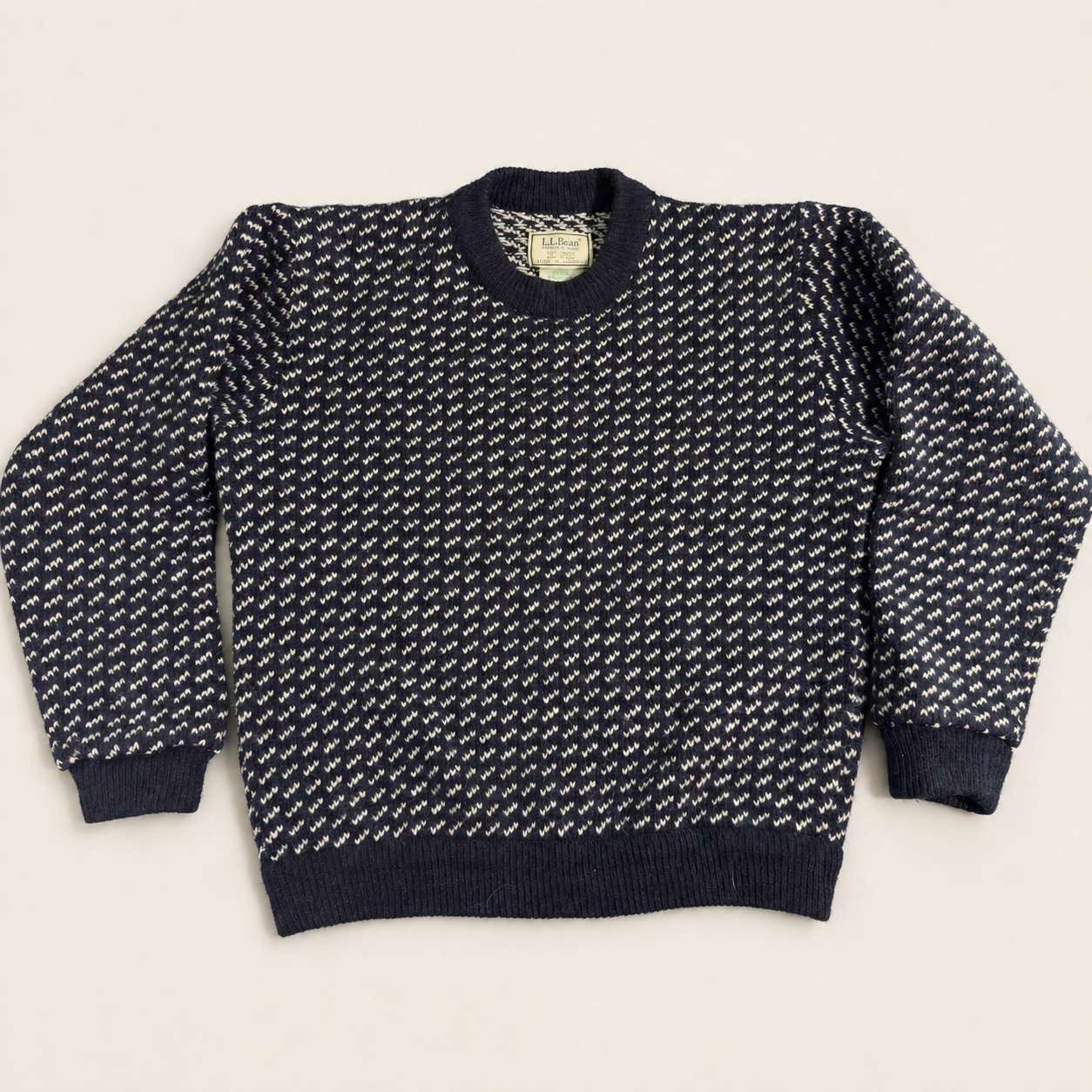 Vintage navy and off-white L.L.Bean Norwegian birdseye wool sweater displayed against a clean background